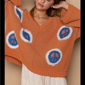 Peace of Mind V neck Women’s Orange Peace Sign Knit Sweater